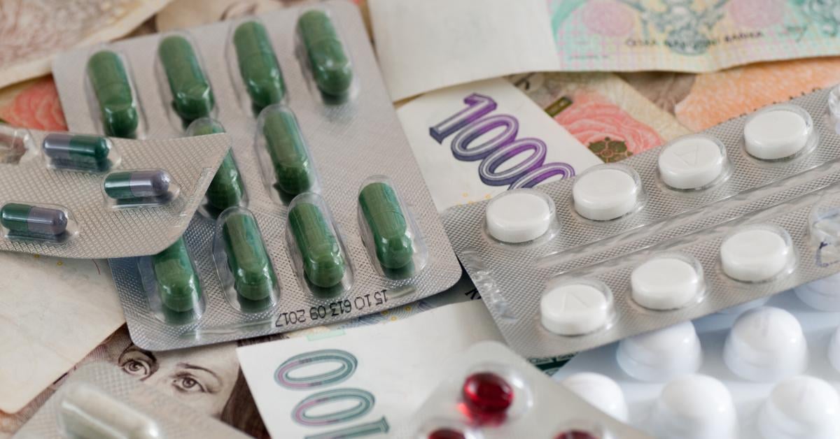 Counterfeit pills and dollar bills representing the lucrative black market  